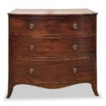 Bow front Regency 3 drawer chest side