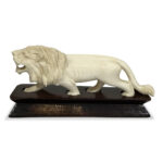 Oriental ivory lion on timber platform base c. 1930