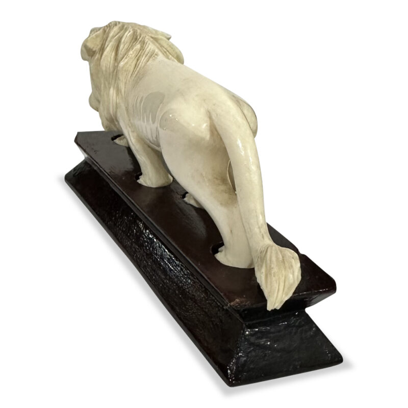 Oriental ivory lion on timber platform base c. 1930