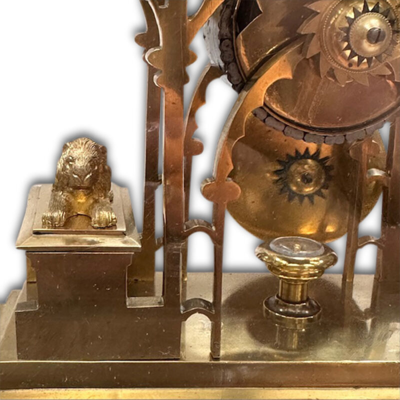 19th century brass skeleton clock in glass dome on marble base