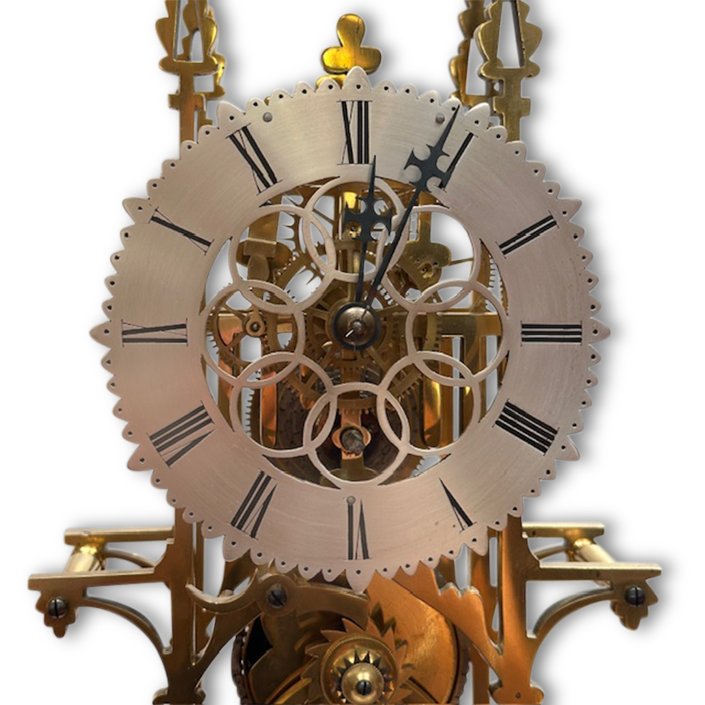 19th century brass skeleton clock in glass dome on marble base