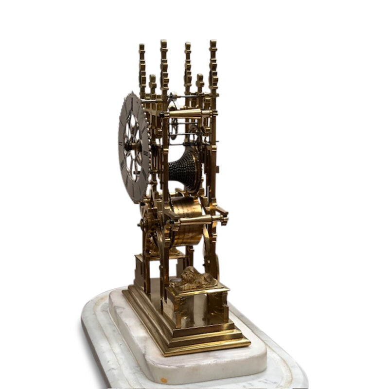 19th century brass skeleton clock in glass dome on marble base